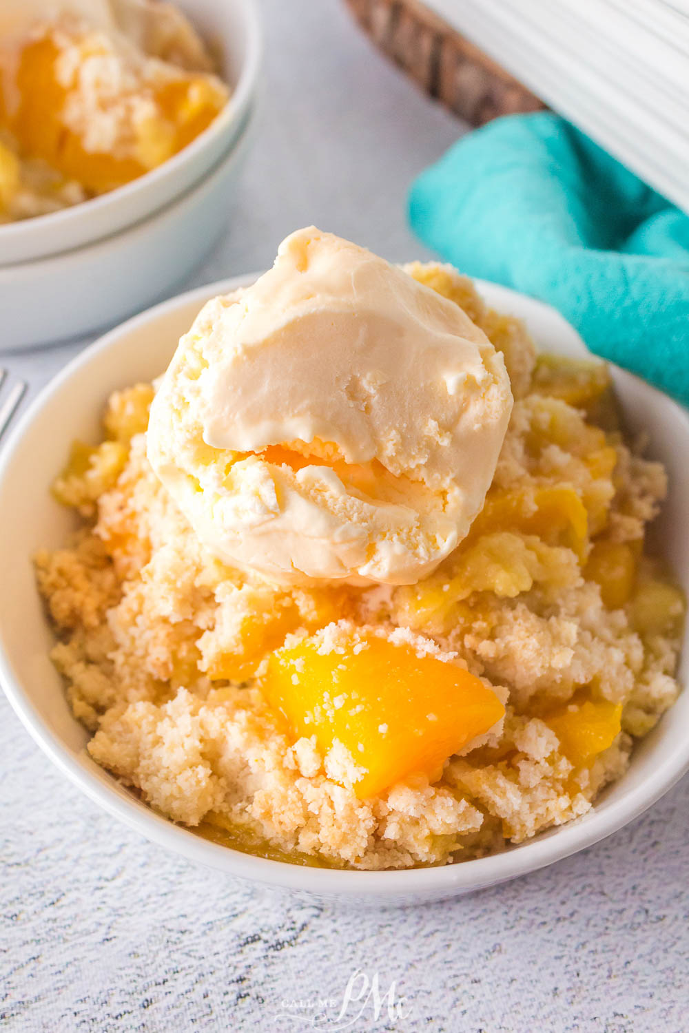 Bowl of dessert topped with ice cream.