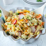 This is an easy and quick Napa Cabbage Ramen Slaw with a nice Asian flavor profile. This salad is full of fresh, crunchy vegetables, ramen noodles, and honey soy dressing.