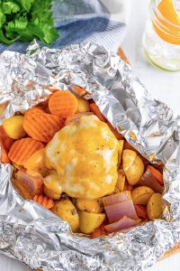 Hamburger Hobo Dinner Foil Pack recipe for camping or cooking at home your prep-ahead meal is all in one pack with little to no cleanup.