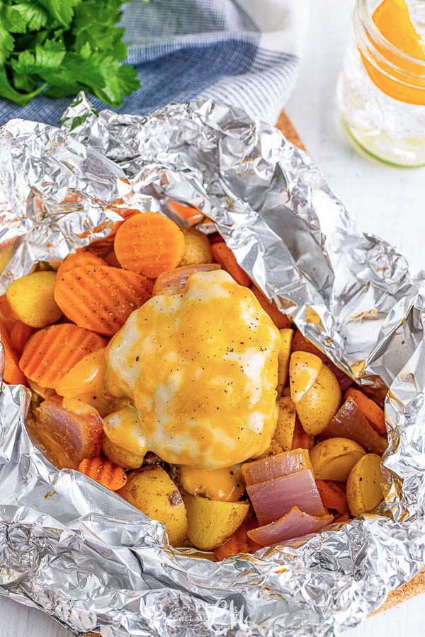 Hamburger Hobo Dinner Foil Pack recipe for camping or cooking at home your prep-ahead meal is all in one pack with little to no cleanup.