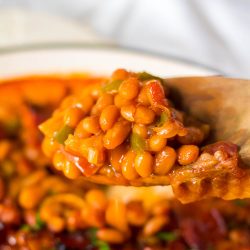 Smokey, spicy, and delicious, Dr Pepper Baked Beans Recipe from Call Me PMc has the best flavor and consistency. They are the perfect side dish for any barbecue. Great for potlucks, picnics, and tailgating!