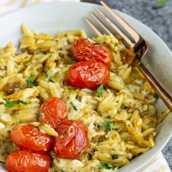 One Pan Baked Caprese Orzo recipe will become your busy night's go-to meal! Yes, even the orzo pasta cooks in the same pan in the oven!