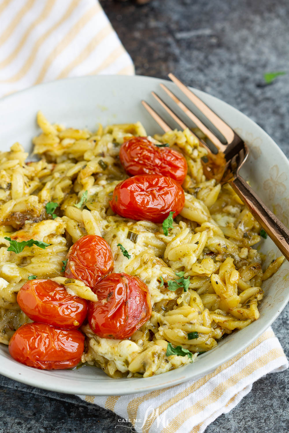 One Pan Baked Caprese Orzo recipe will become your busy night's go-to meal! Yes, even the orzo pasta cooks in the same pan in the oven!