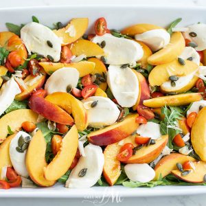 Peach Tomato Caprese Salad Recipe is full of juicy peaches, fragrant basil, creamy fresh mozzarella, and tender lettuce. #salad #capresesalad #peach #recipes #callmepmc