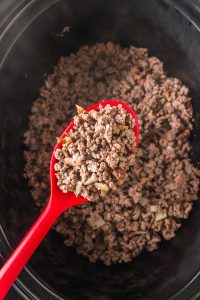 A Slow Cooker full of ground beef with Cheesy Penne.