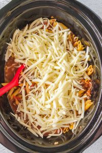 A Slow Cooker filled with Cheesy Penne.