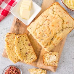 Every bite is loaded with flavor in this No Yeast Bacon Cheddar Cheese Quick Bread. It's a delicious bread stuffed with cheddar cheese and crumbled bacon.