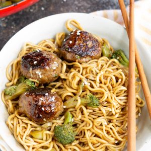 Mongolian Meatballs Ramen recipe, tender and juicy beef meatballs are smothered in a sweet and tangy Asian-inspired sauce and sit on a bed of ramen noodles. This dinner recipe is a flavor sensation.  #meatballs #ramen #recipes #dinner
