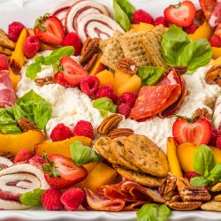 Burrata Charcuterie Board, or any meat and cheese board, is the easiest way to entertain. Make your guests happy and load a beautiful wood tray with foods full of flavor, texture, and eye-popping color.