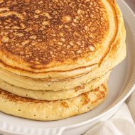 Up your breakfast game with the Fluffiest Homemade Buttermilk Pancakes. You’re going to love the decadent texture, beautiful flavor, and minimal ingredients. #pancakes #breakfast