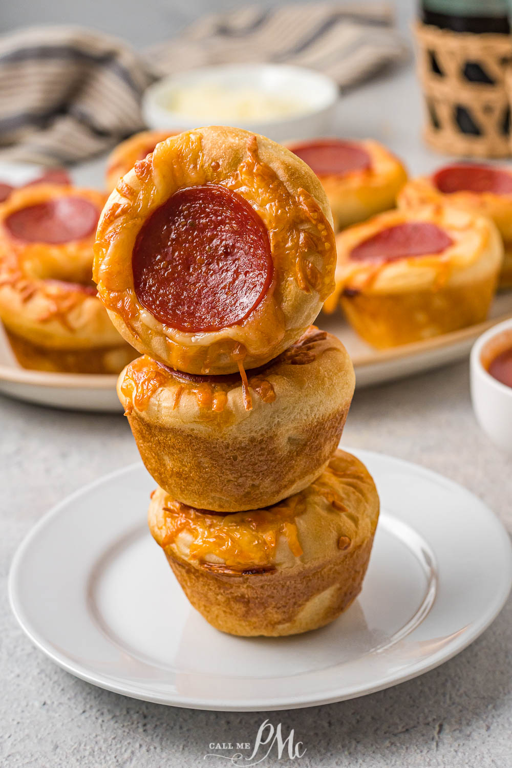A stack of pizza bites on a plate.