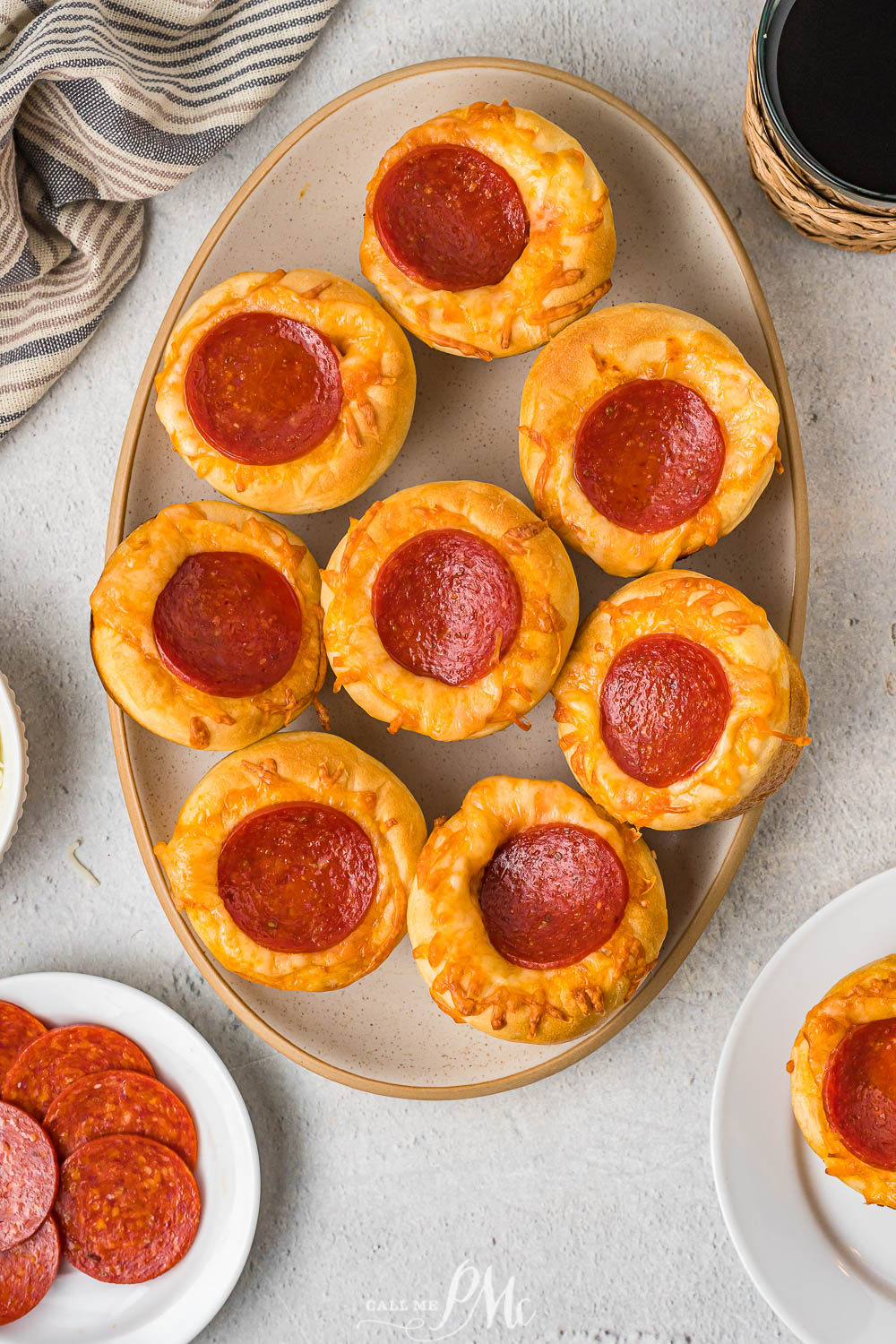 Pepperoni muffins on a plate.