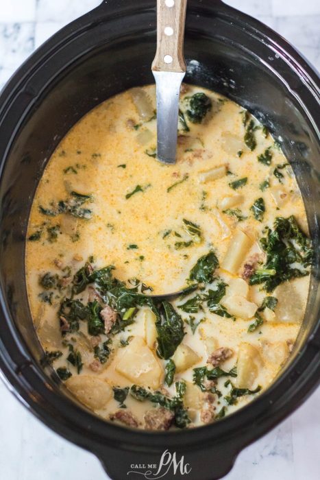 A pot with sausage and spinach.