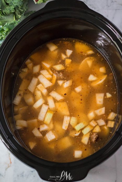 A slow cooker full of zuppa toscana.