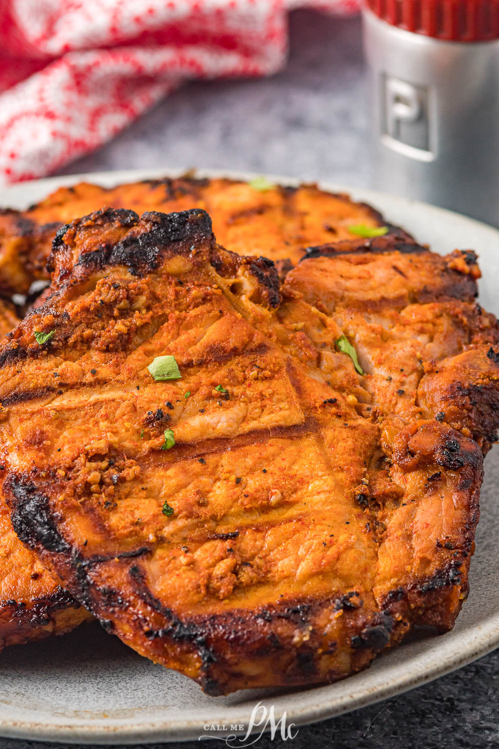 grilled pork chops on a serving platter.