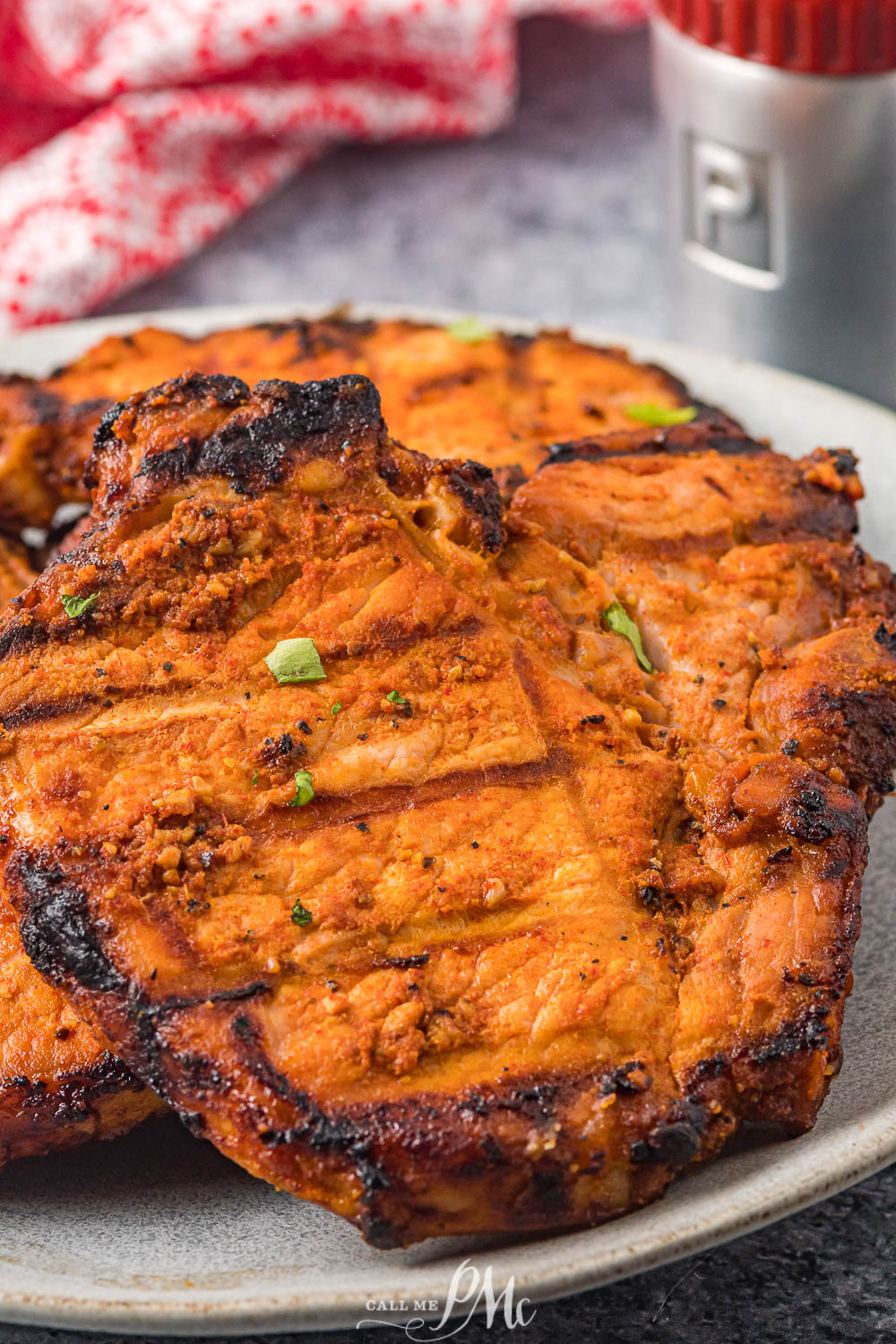 Ultimate Grilled Pork Chops grilled pork chops on a serving platter.