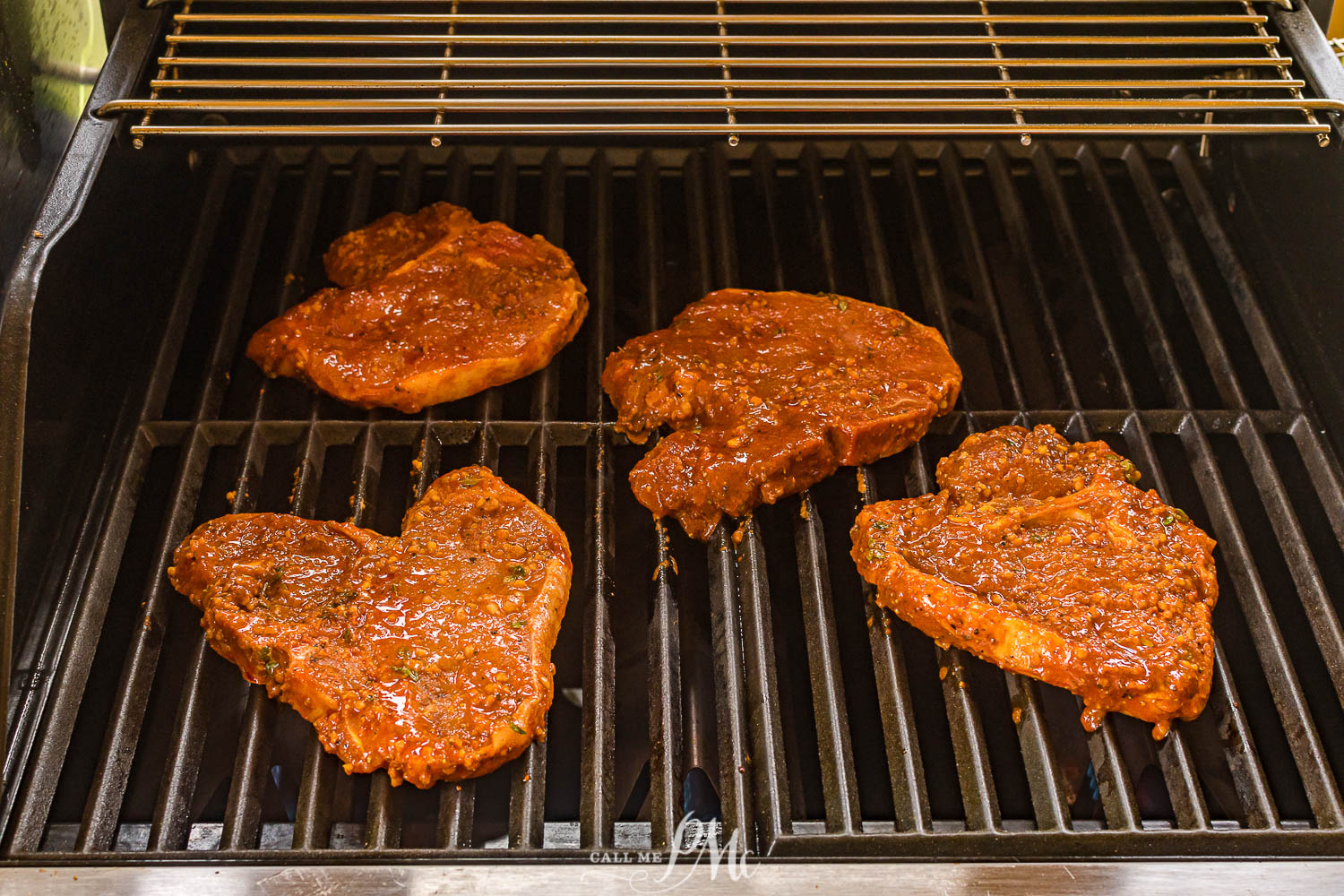boneless pork chops on the grill.