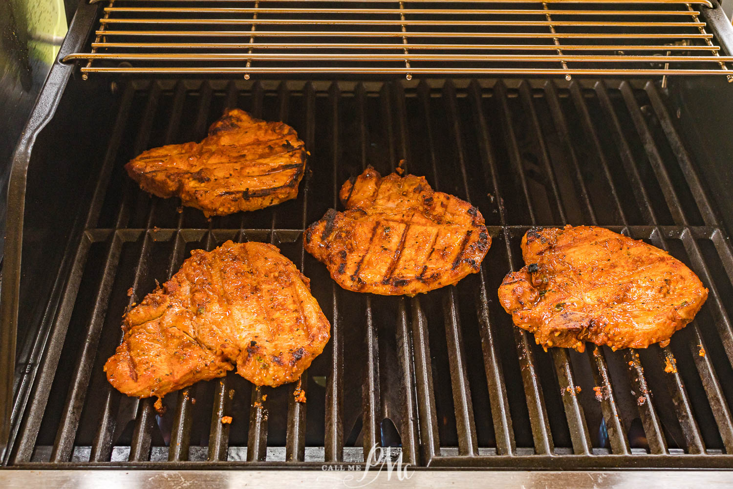 grilling pork chops on gas grill.