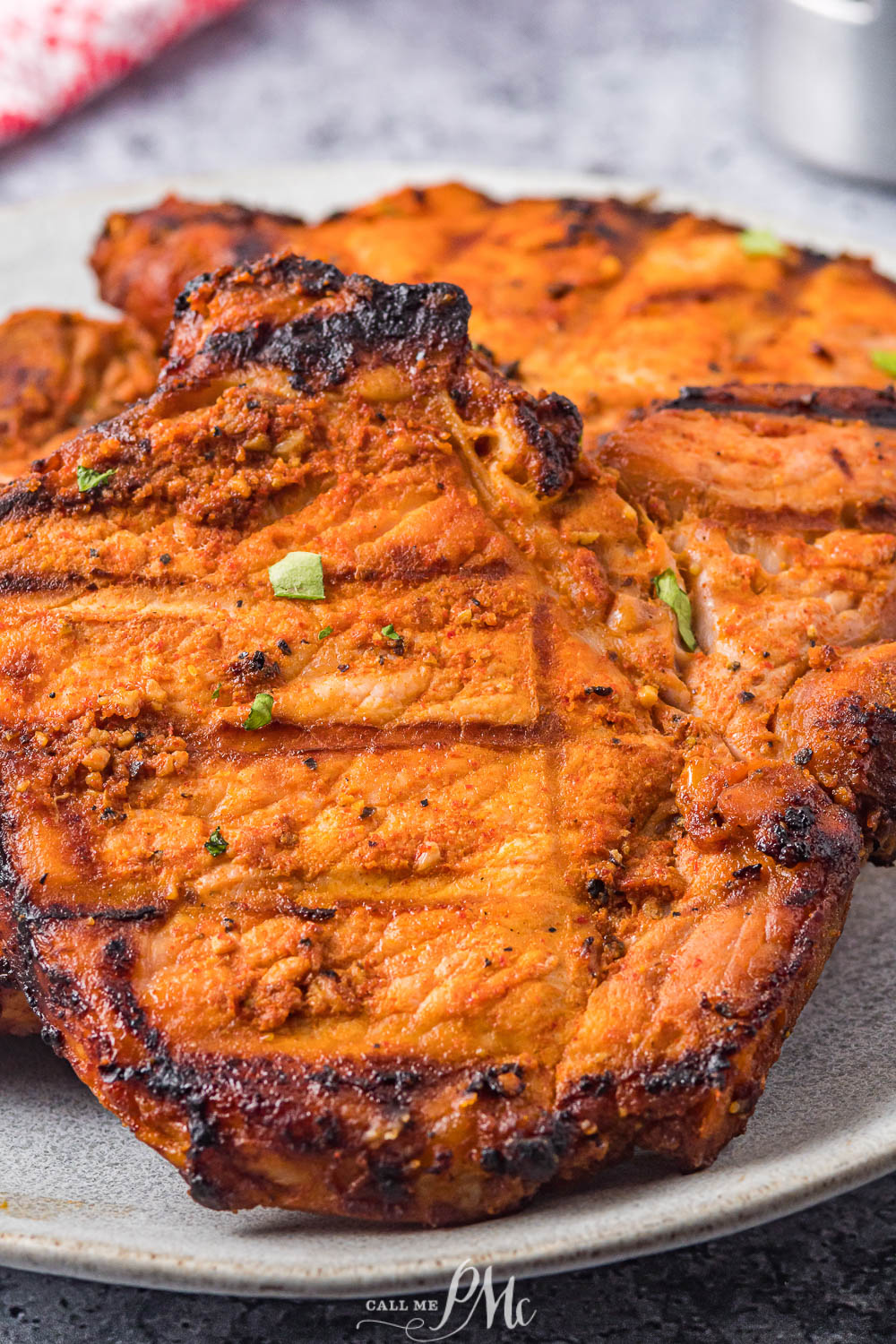 grilled pork chops platter of meat cooked on a grill.