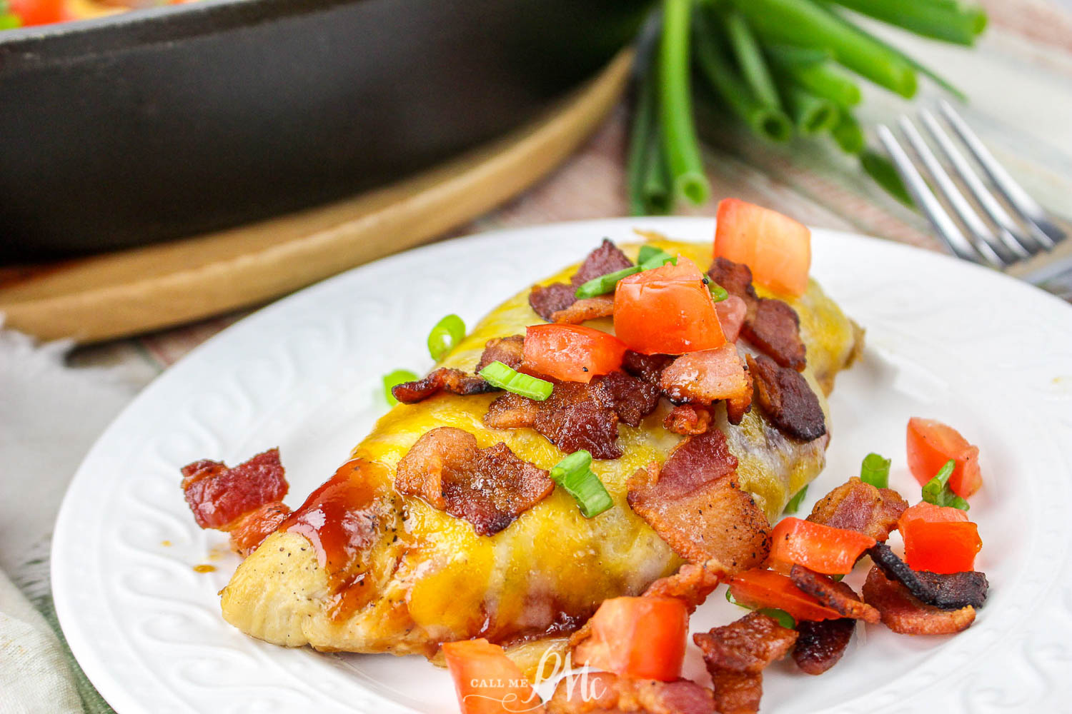 a serving of  Chicken with cheese and bacon displayed on a plate.