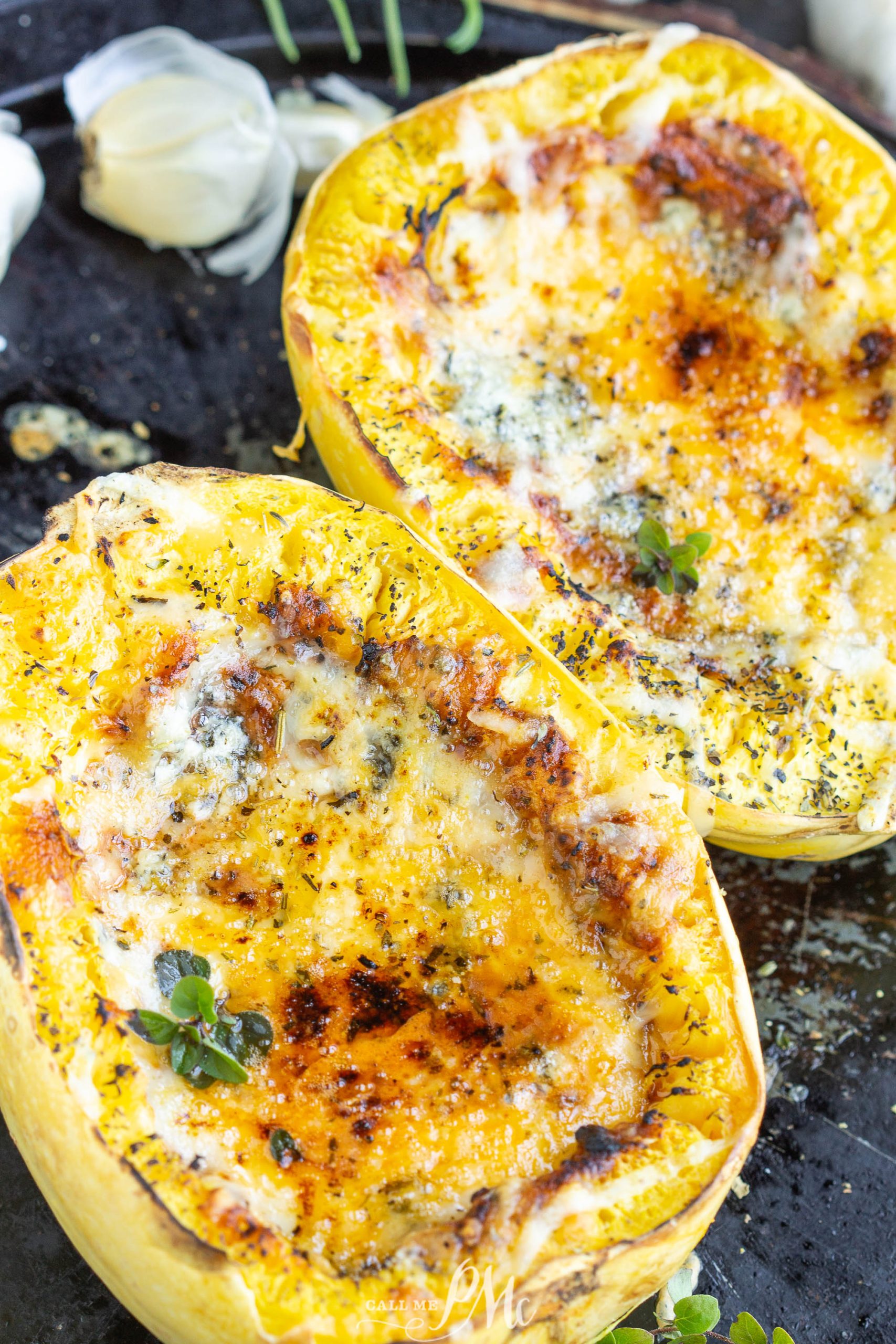 Vodka Sauce Spaghetti Squash Boats Two Vodka Sauce Spaghetti Squash Boats on a black pan.