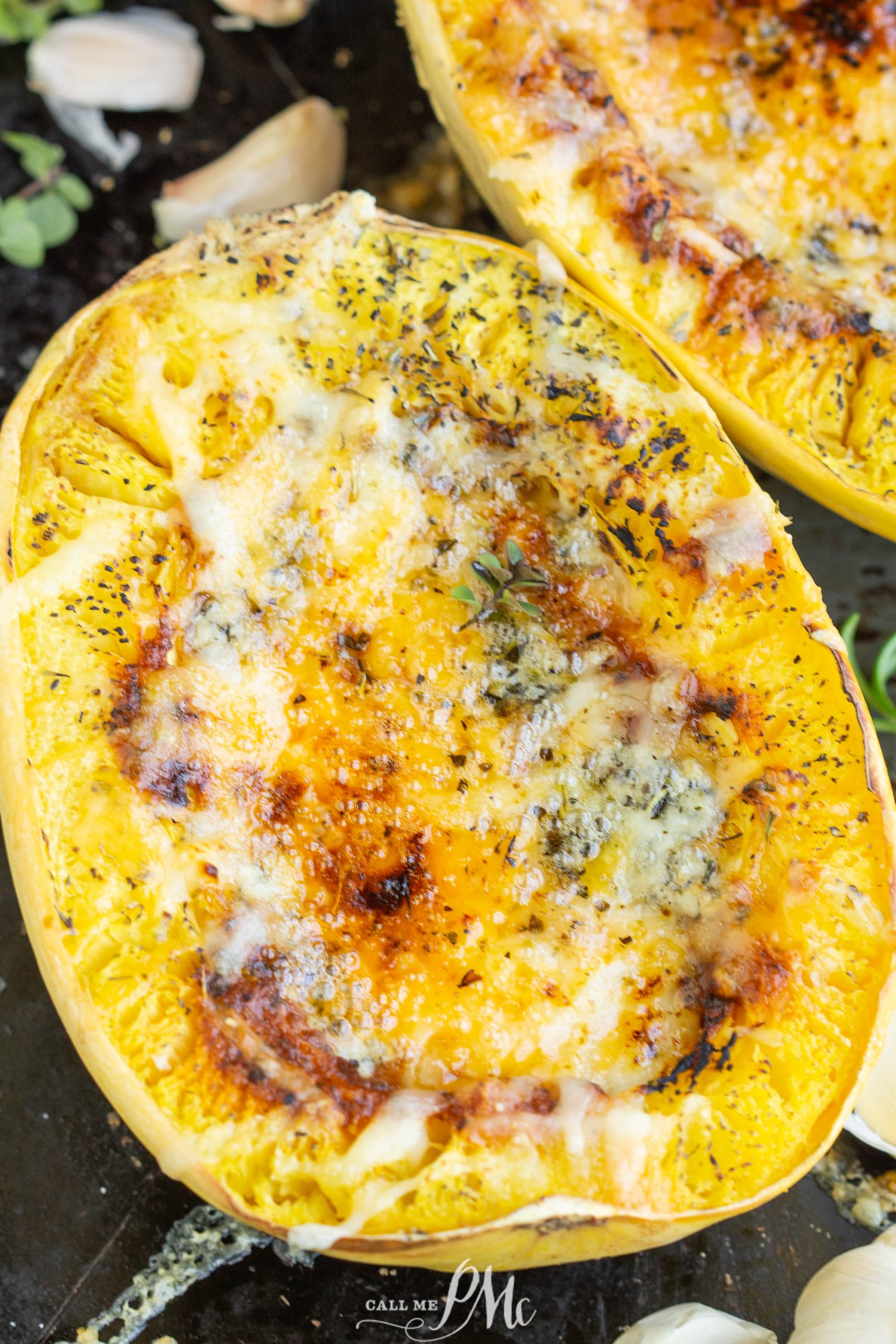 Two Spaghetti Squash Boats topped with cheese and garlic.