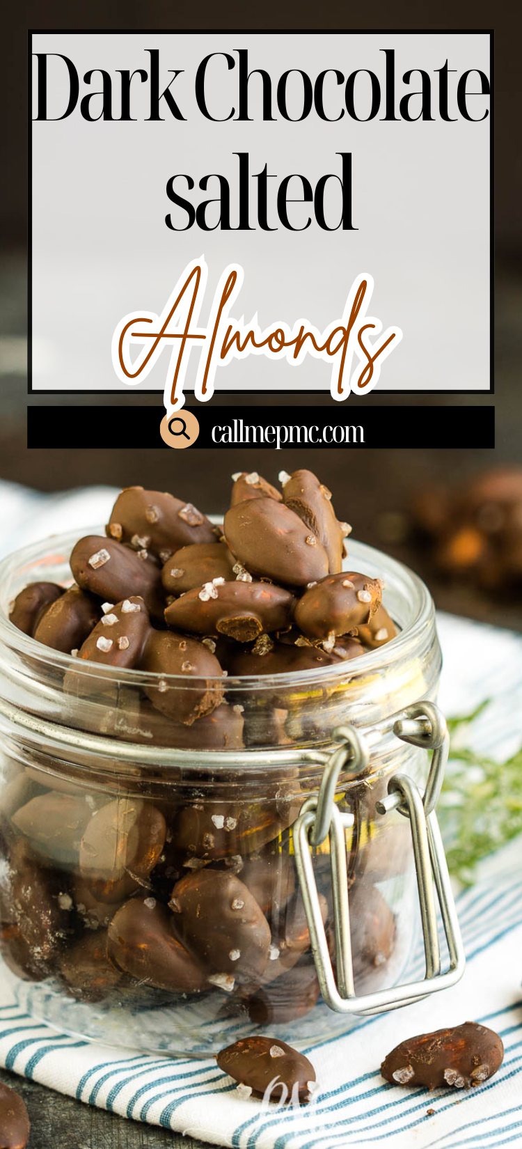 A glass jar filled with Dark Chocolate Salted Almonds sits on a table, with more of these irresistible treats scattered around it.