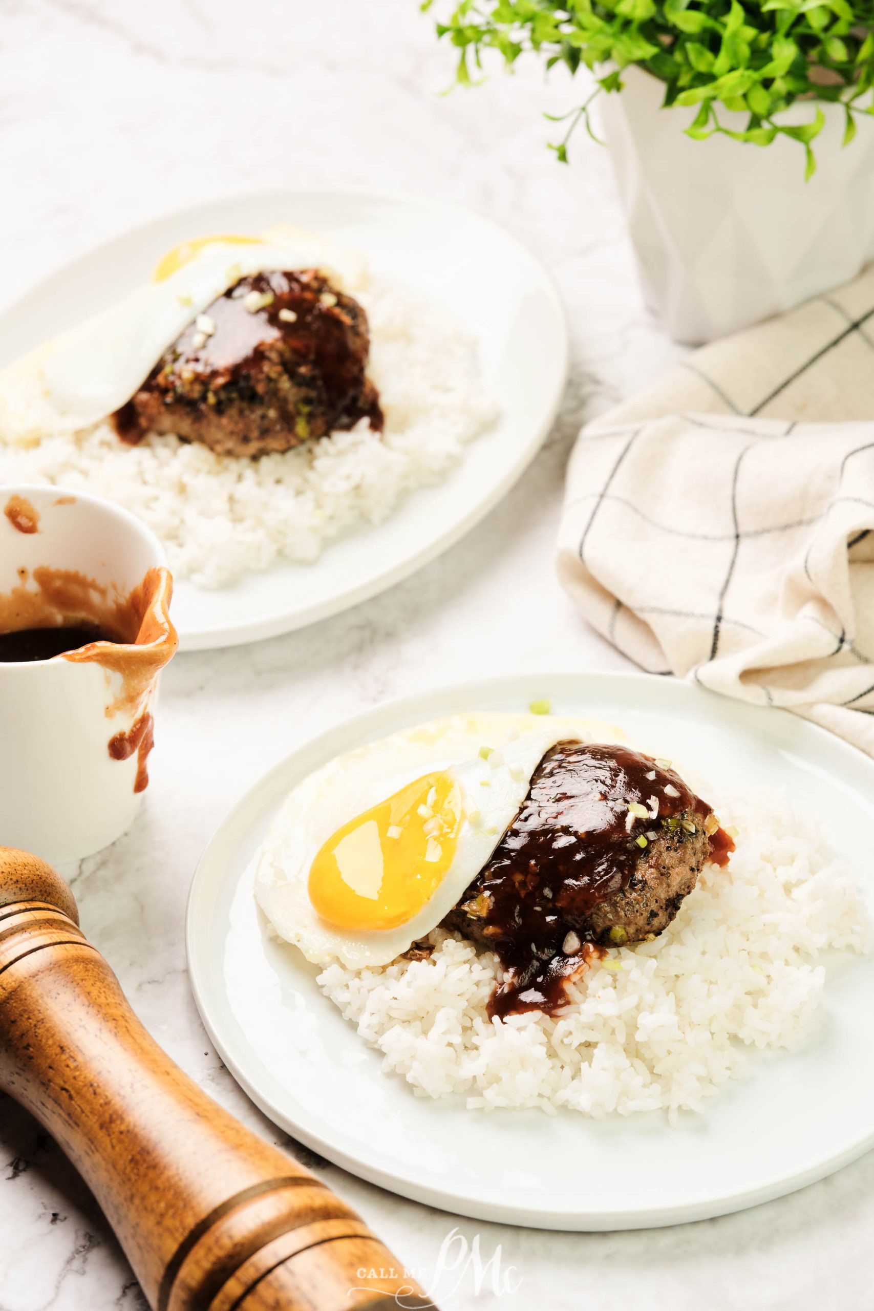 loco moco hamburger on bed of rice all topped with a fried egg