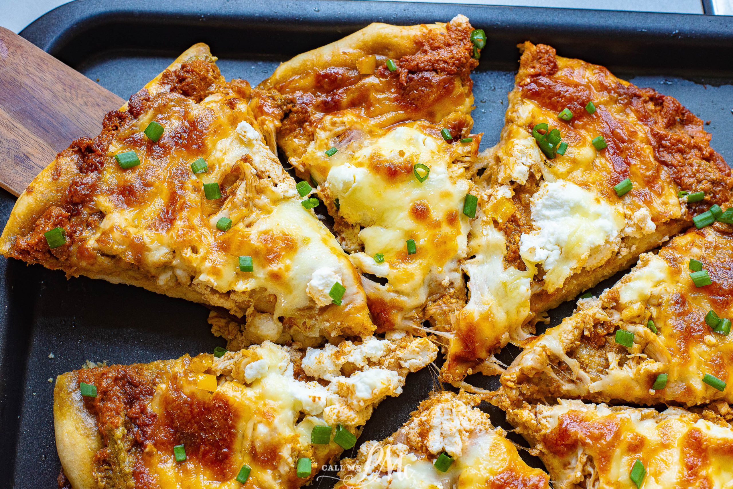 Chicken Pizza loaded with Mozzarella on a tray.