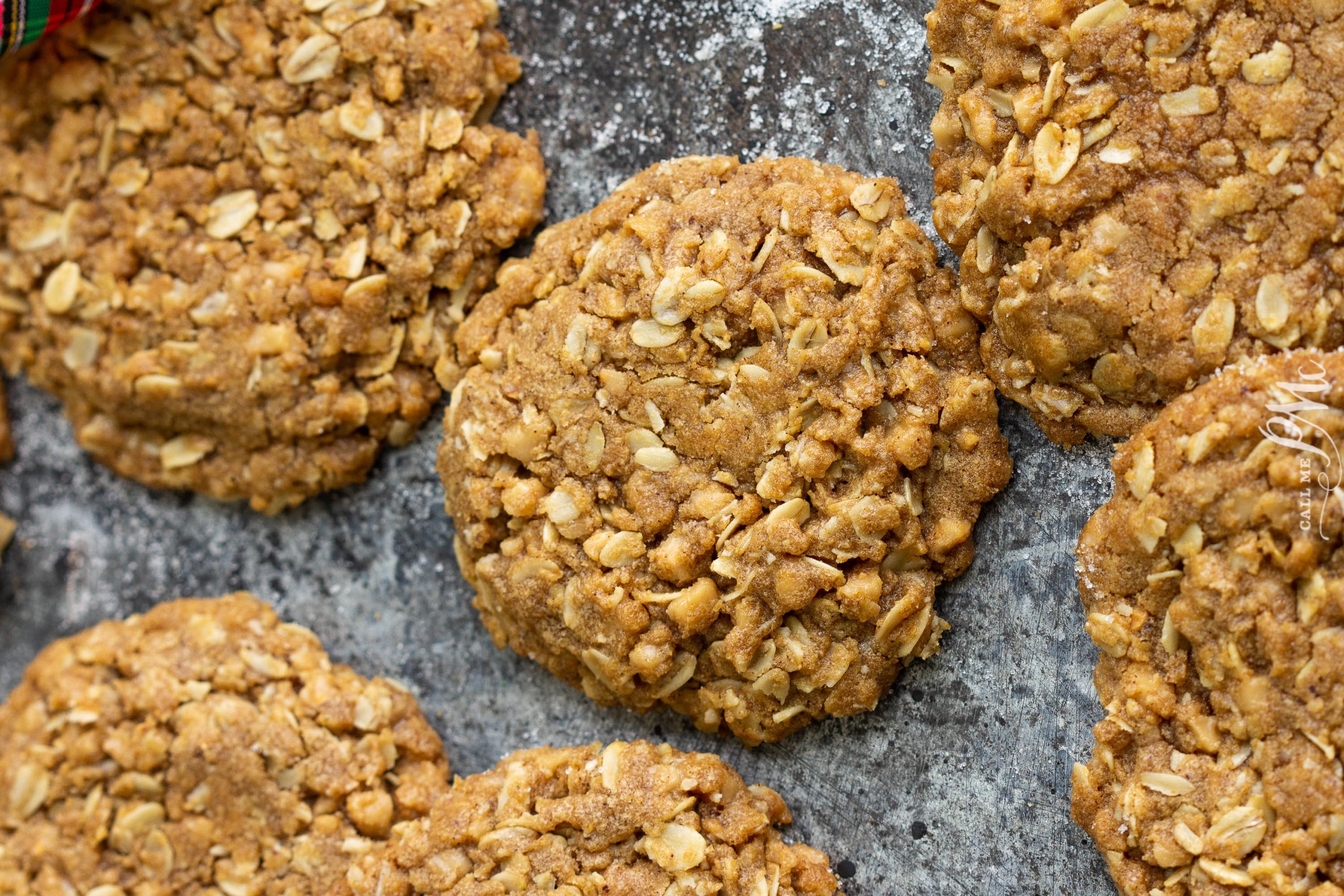 Several Biscoff Crunch Cookies scattered on a table.