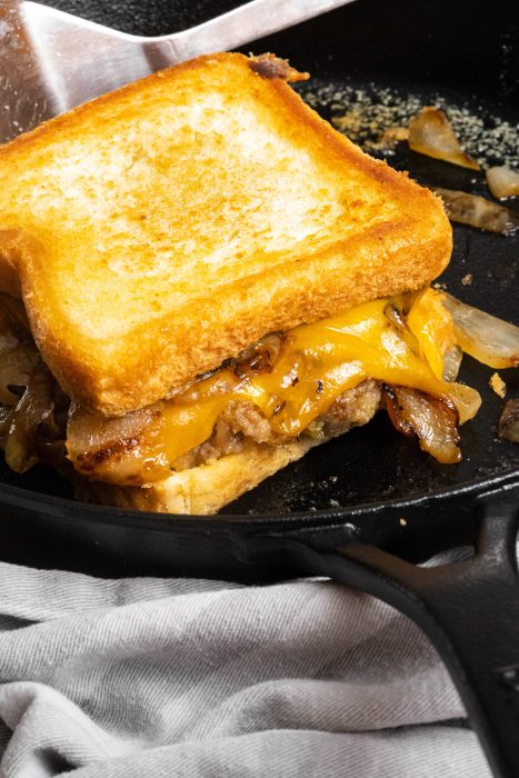 Chicken Fried Steak Patty Melt on a white plate.