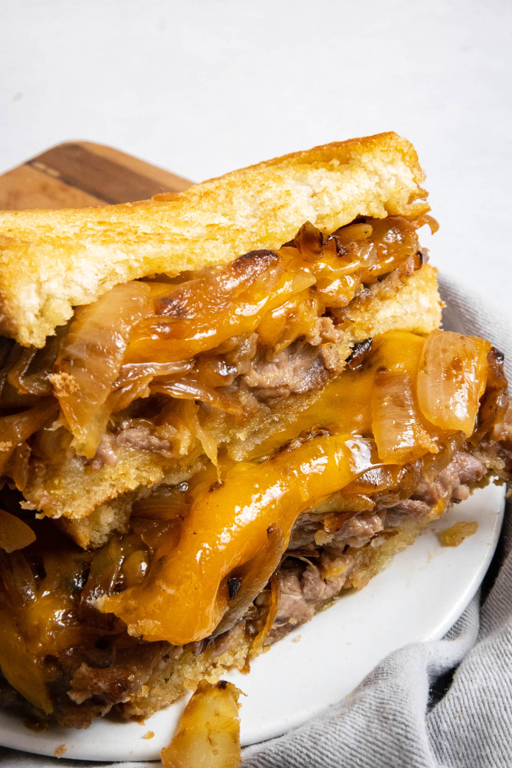 Chicken Fried Steak Patty Melt cut open with melty cheese.