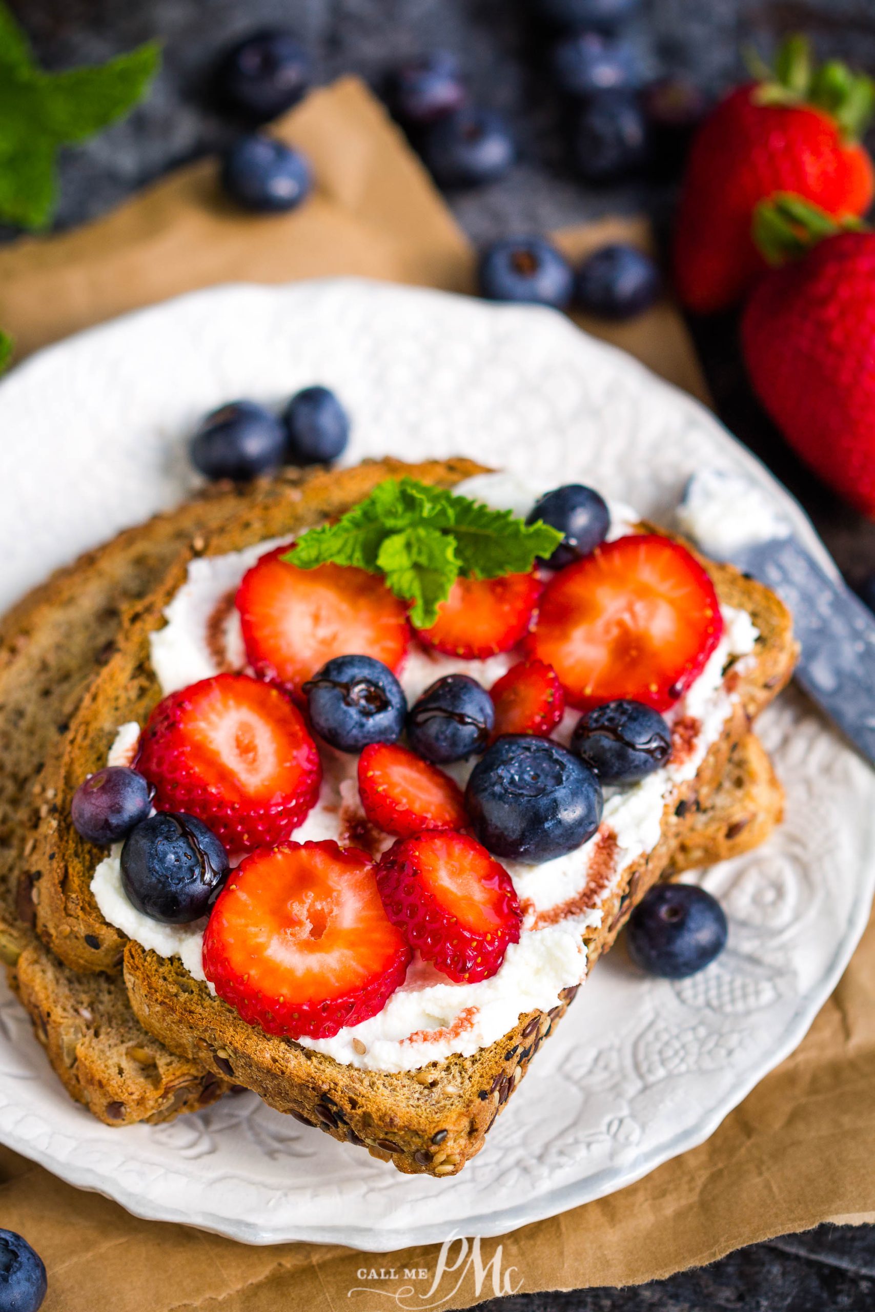 Date Syrup Drizzled Berry Ricotta Toast on plate.