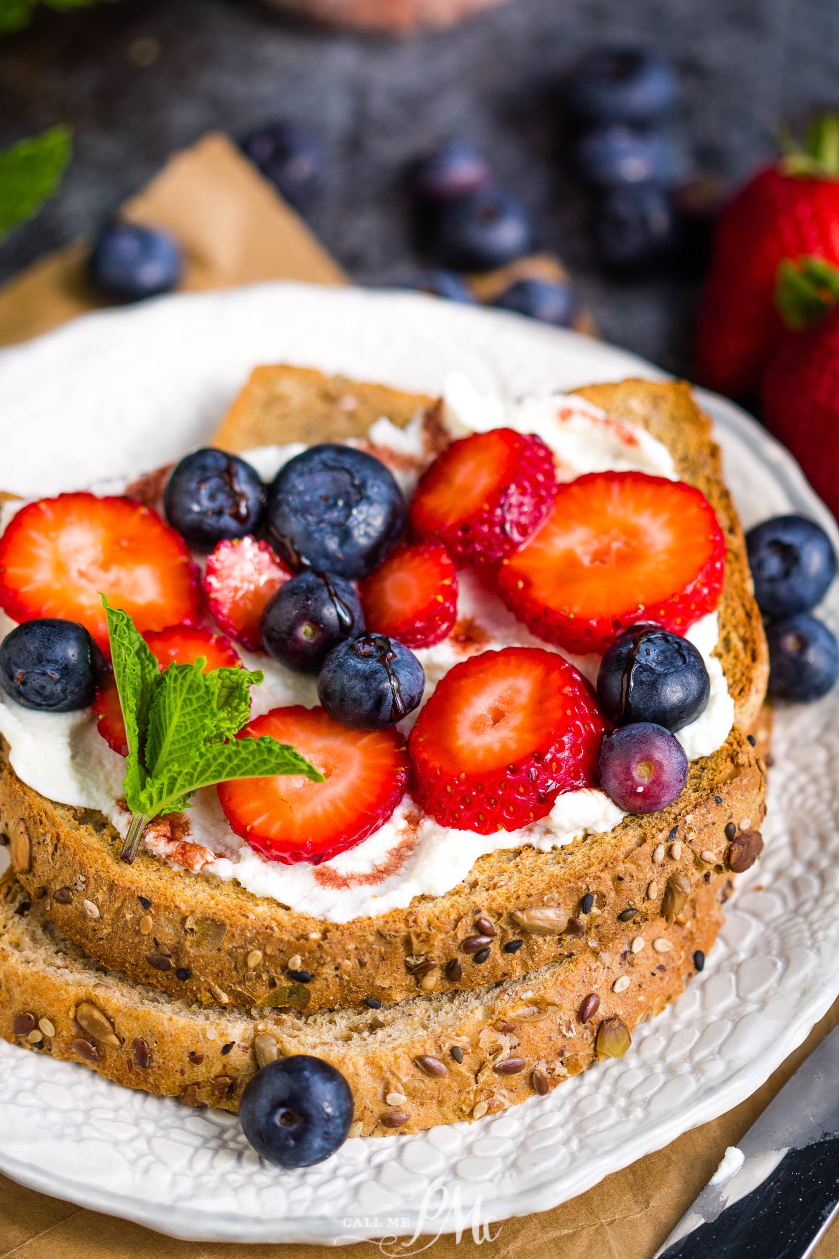 Date Syrup Drizzled Berry Ricotta Toast on plate.