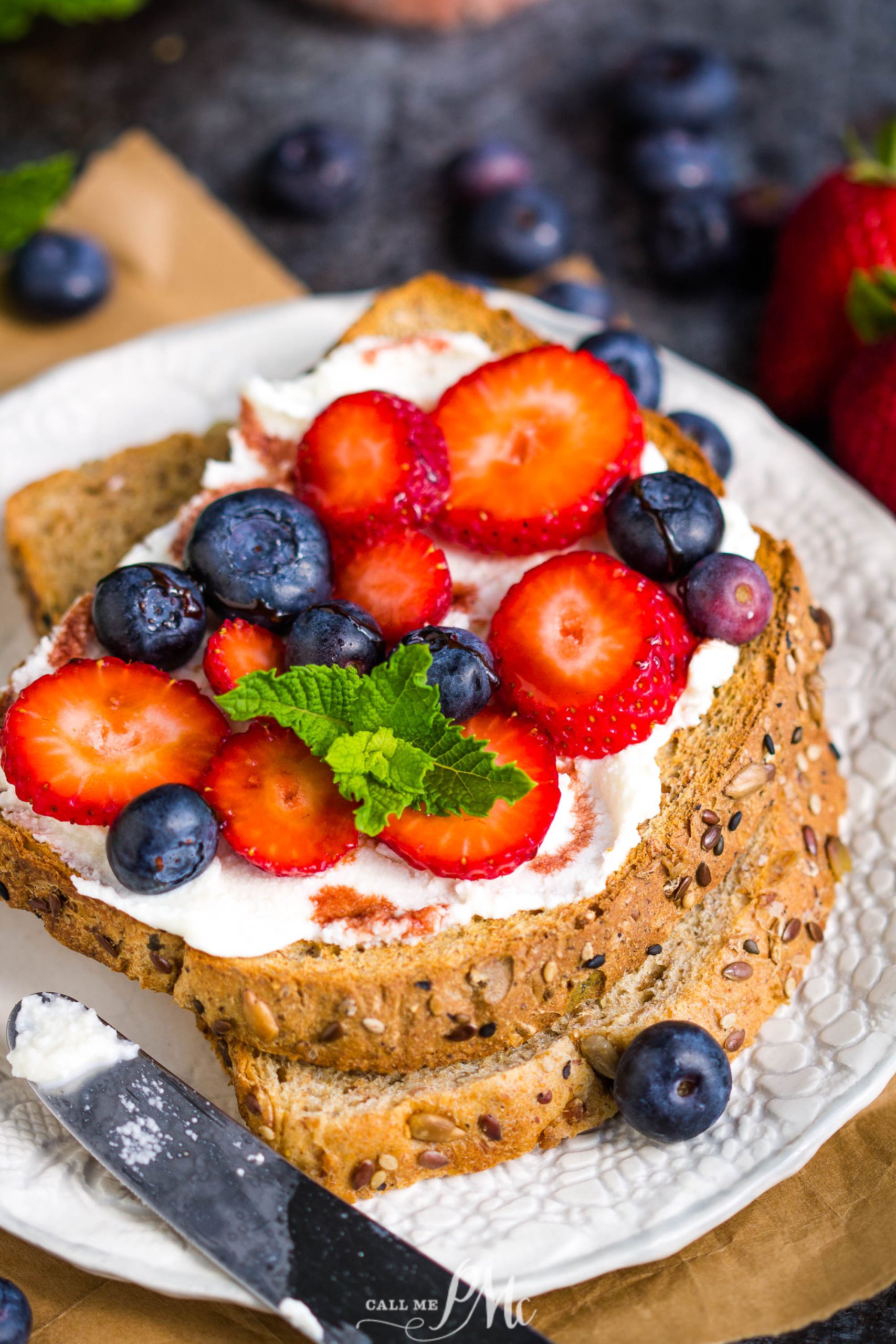 Date Syrup Drizzled Berry Ricotta Toast on plate.