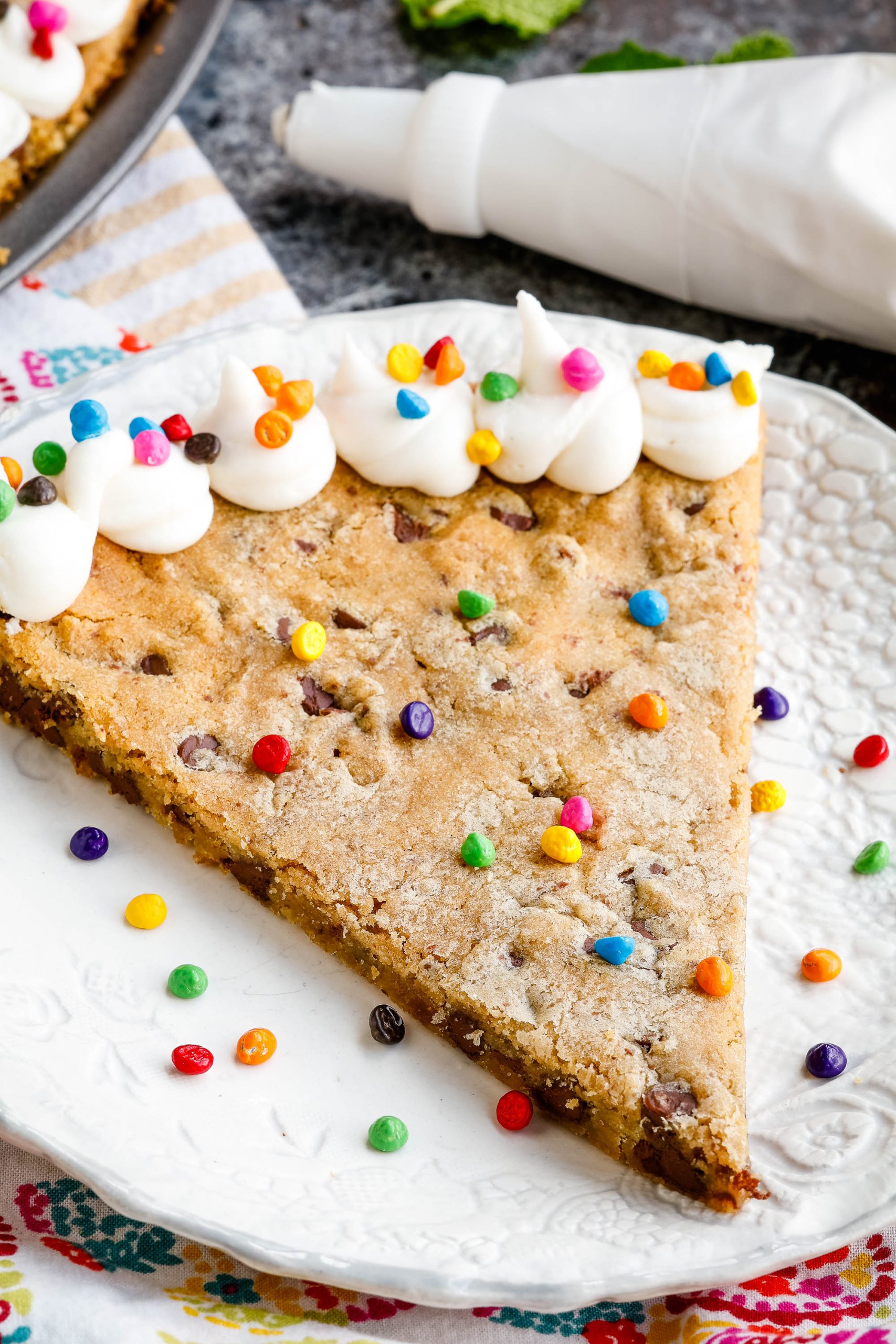 A slice out of a dessert on a plate.