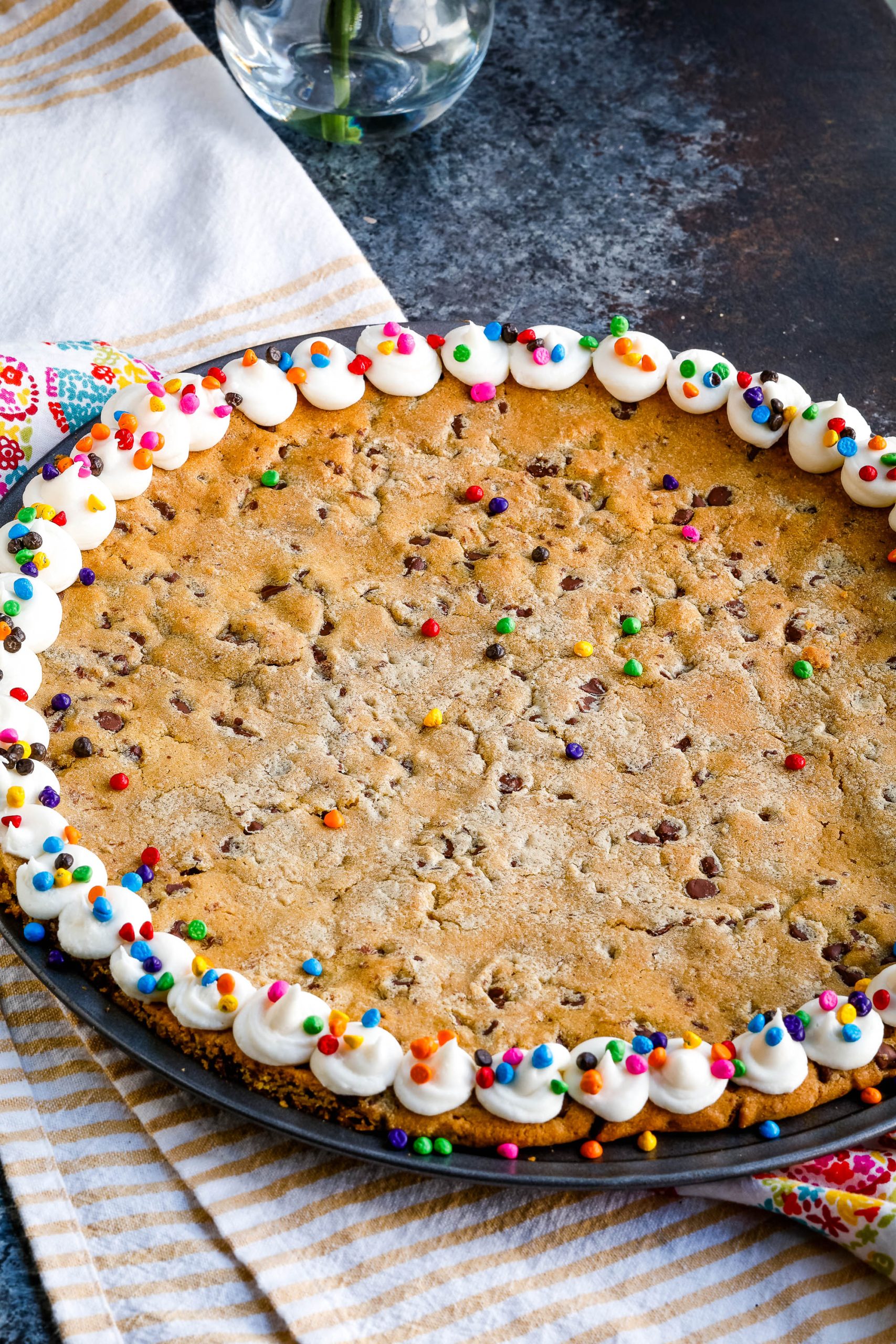 A giant chocolate chip cookie decorated around the edge.