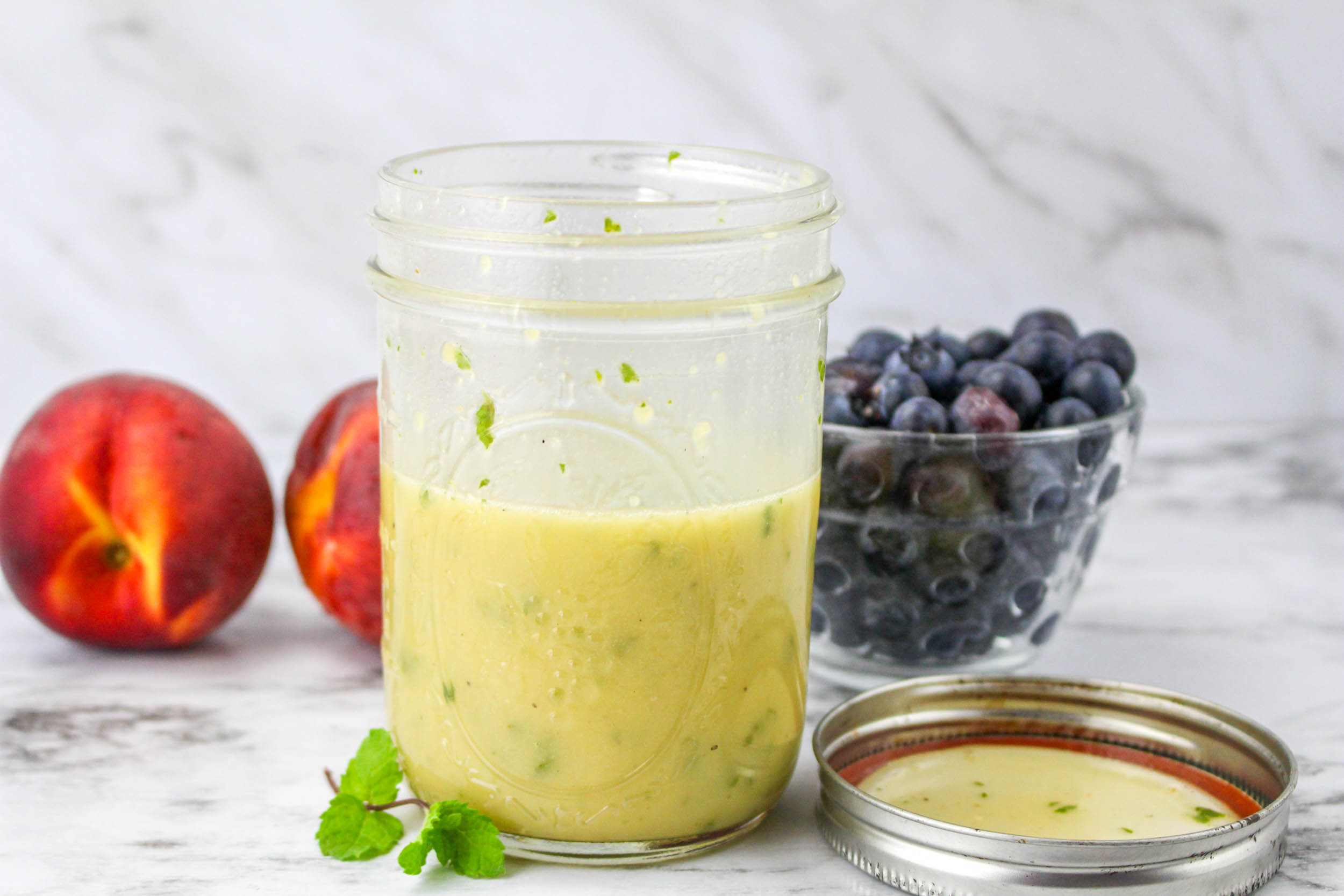 Small jar of salad dressing.