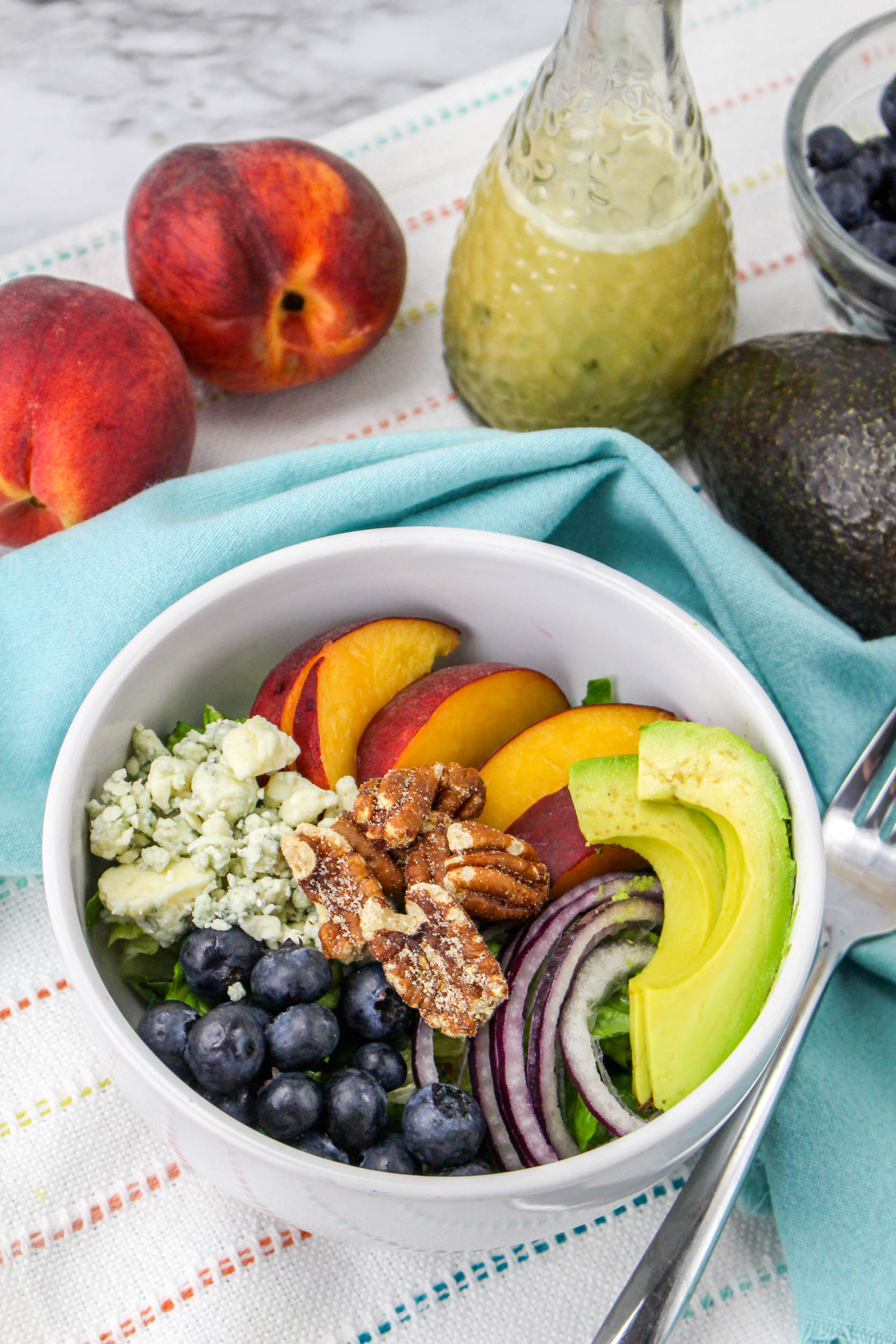 fruit and peaches in a bowl