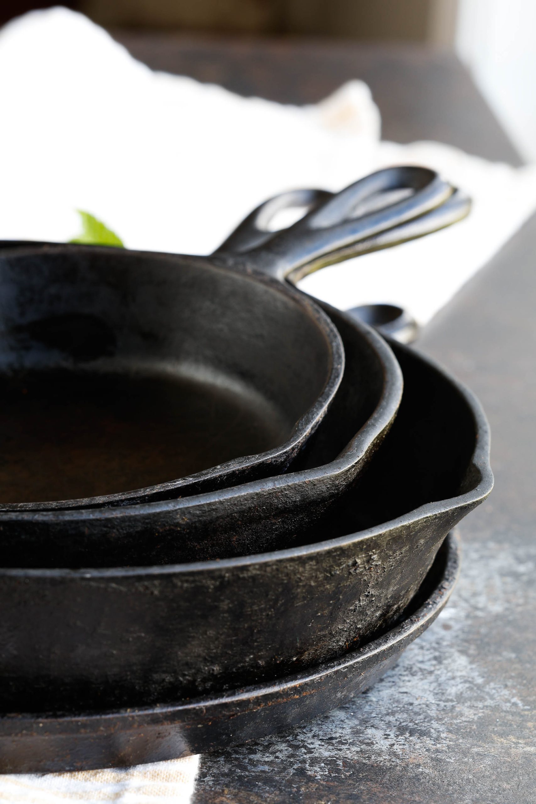 A stack of cast iron skillets.