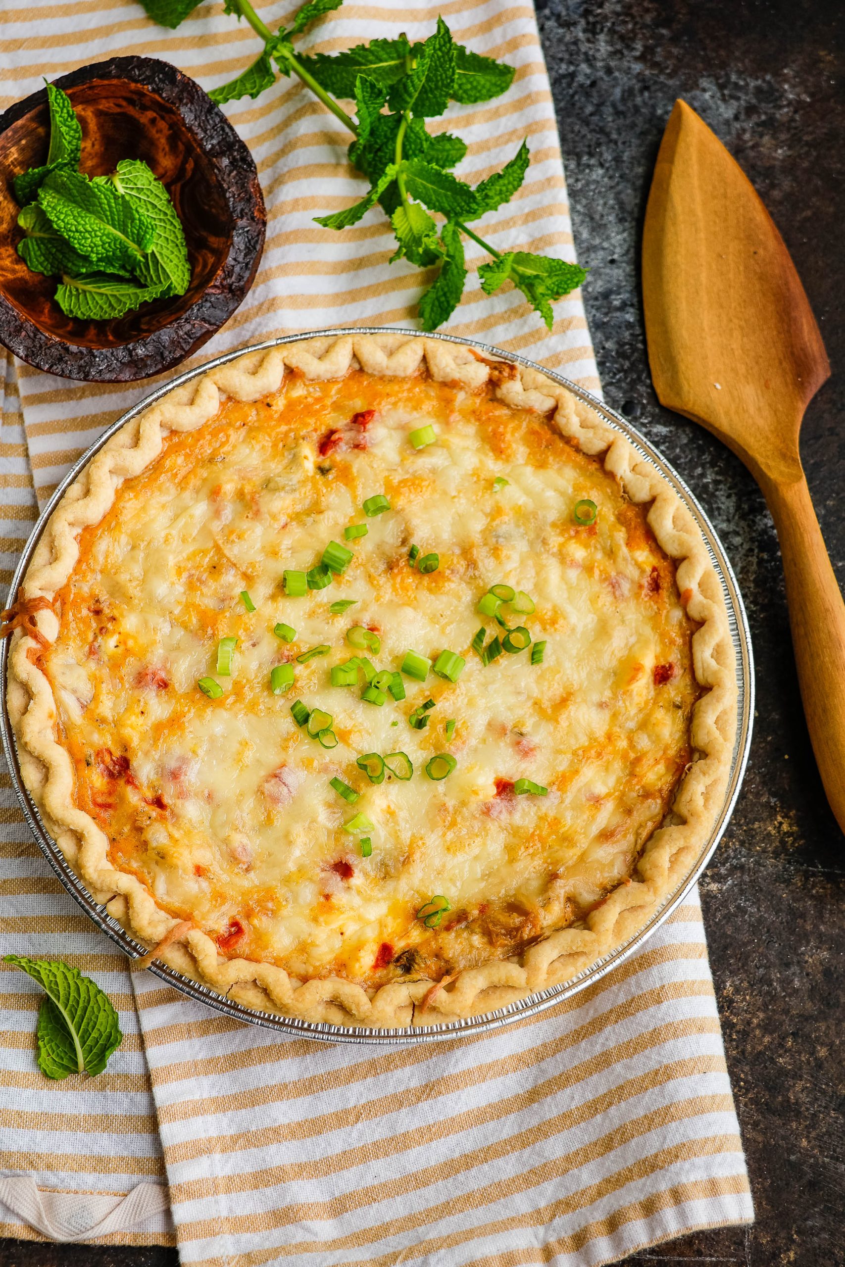 Whole chicken quiche on table.