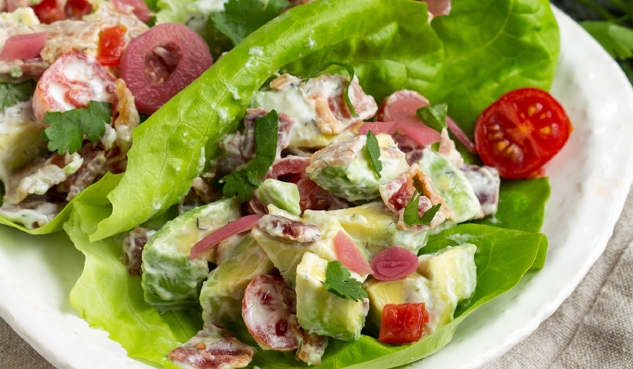 Bibb lettuce Wraps filled with avocado, tomatoes, and bacon