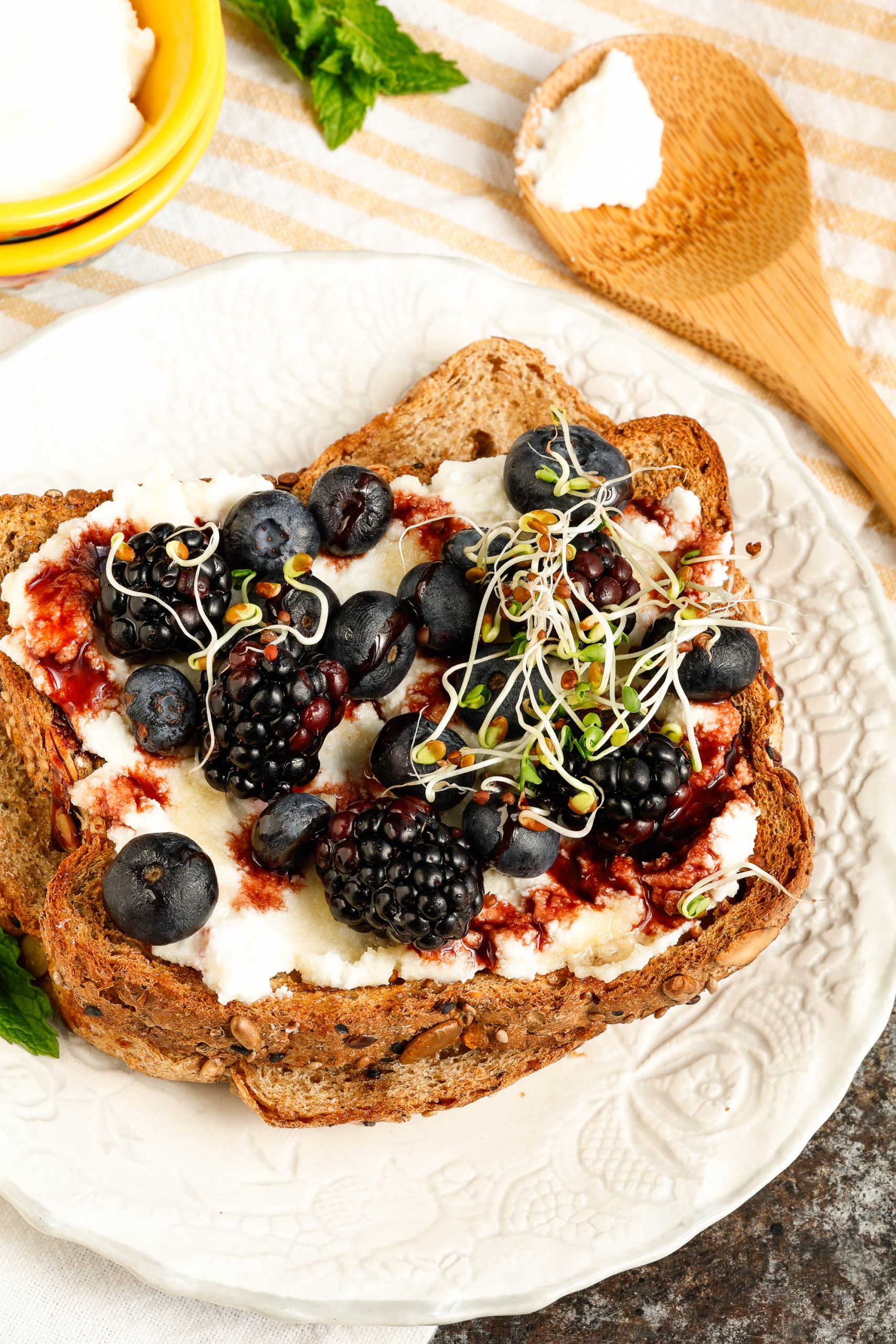 ricotta toast with berries on a saucer