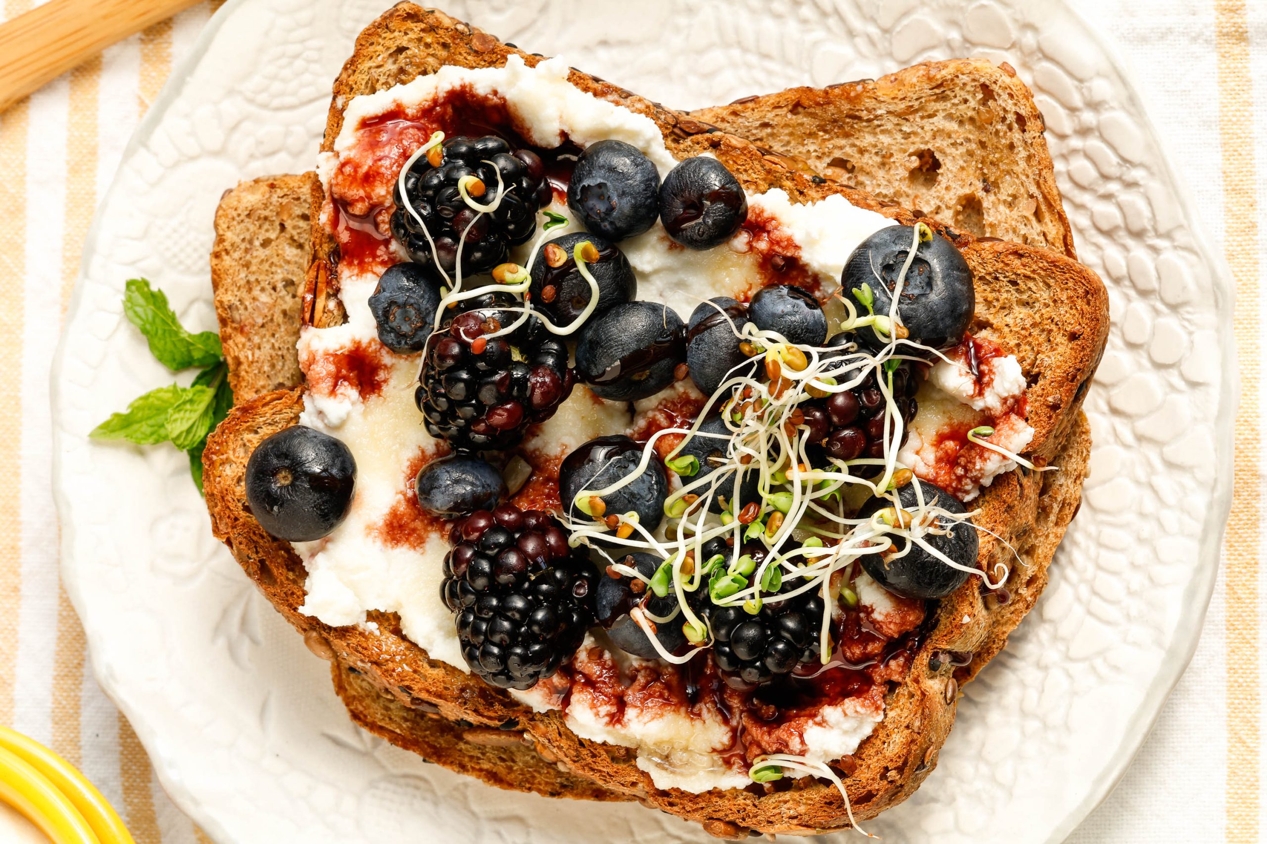 ricotta toast with berries on a saucer