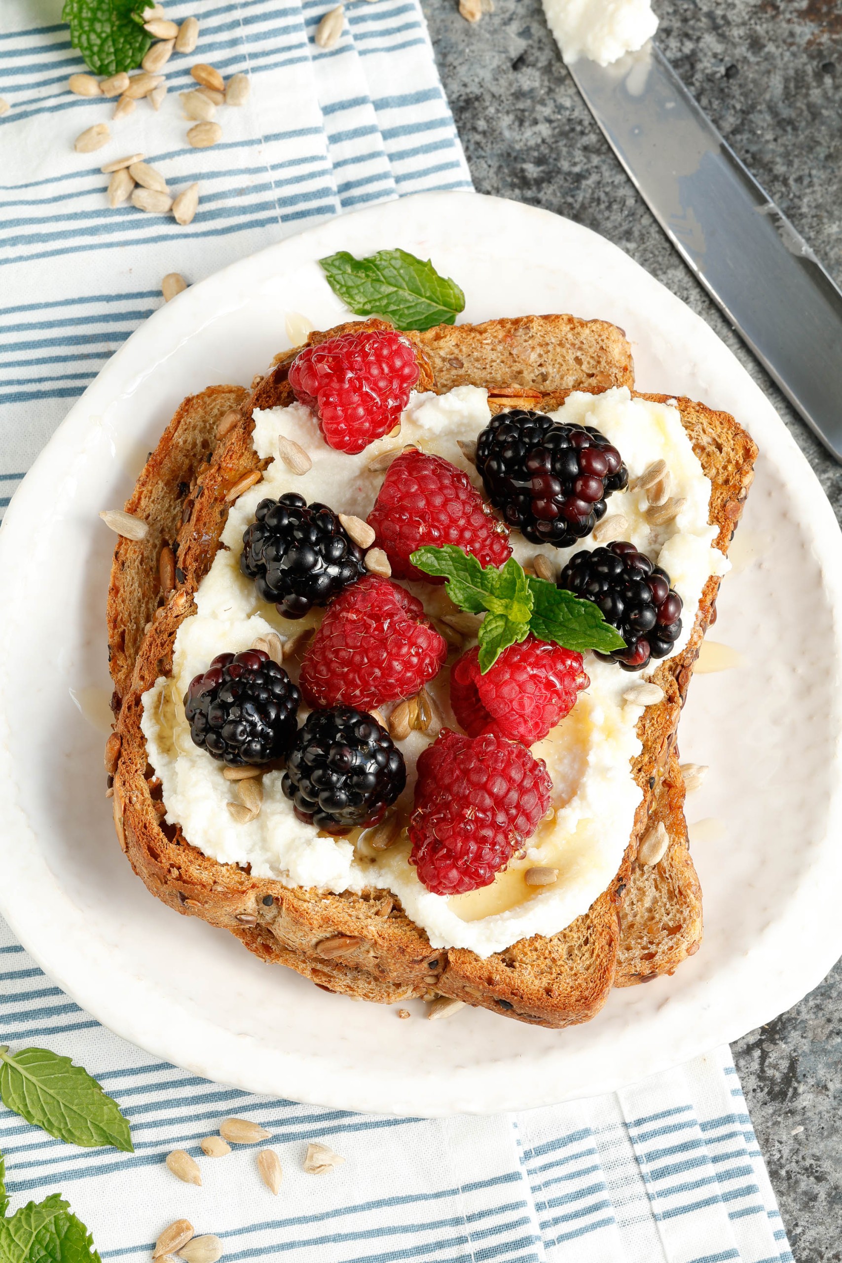 Berries and toasted sourdough on a plate.