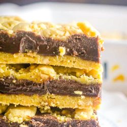 Stack of 3 chocolate bars on a saucer.