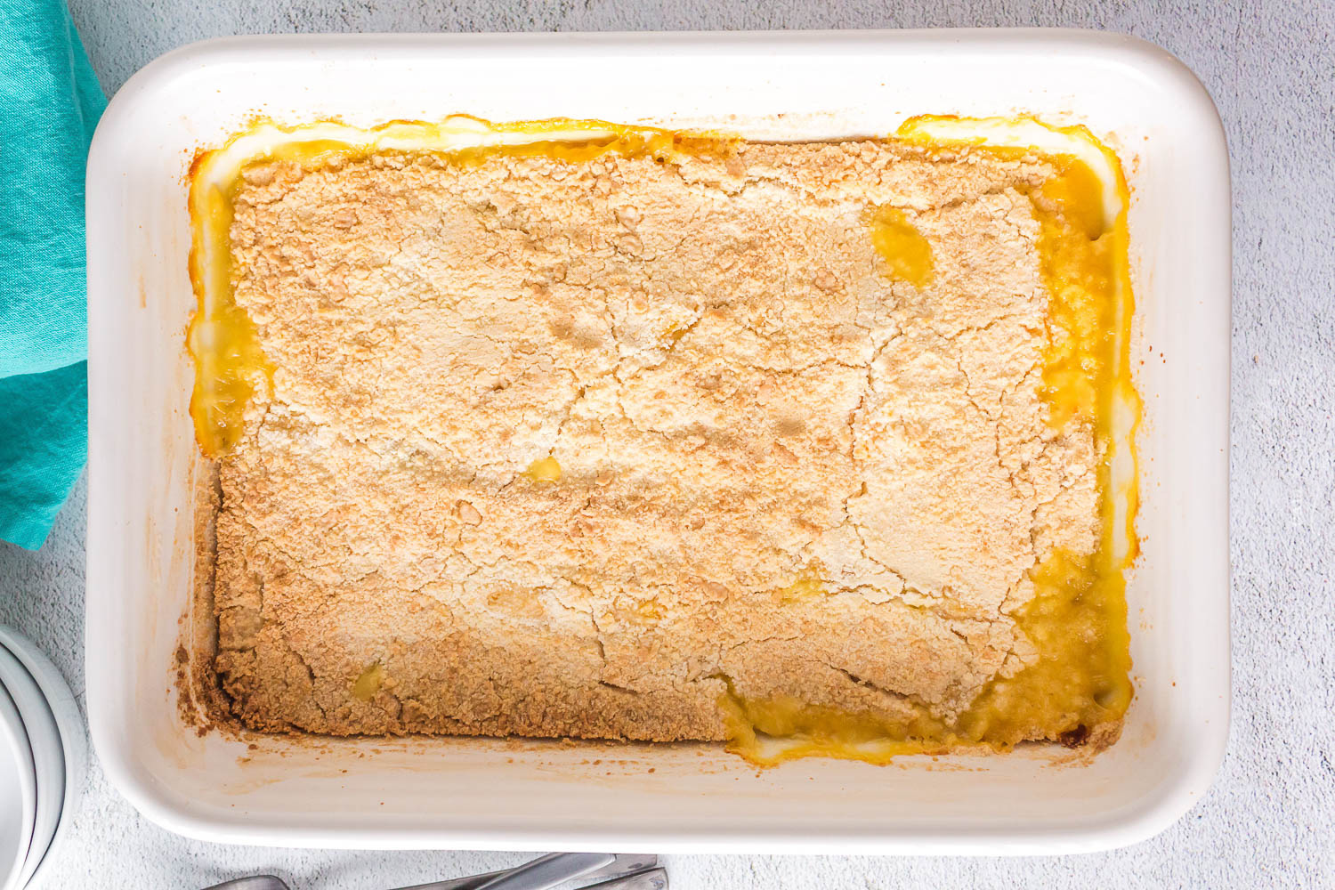 Baked Peach Cobbler in baking pan.