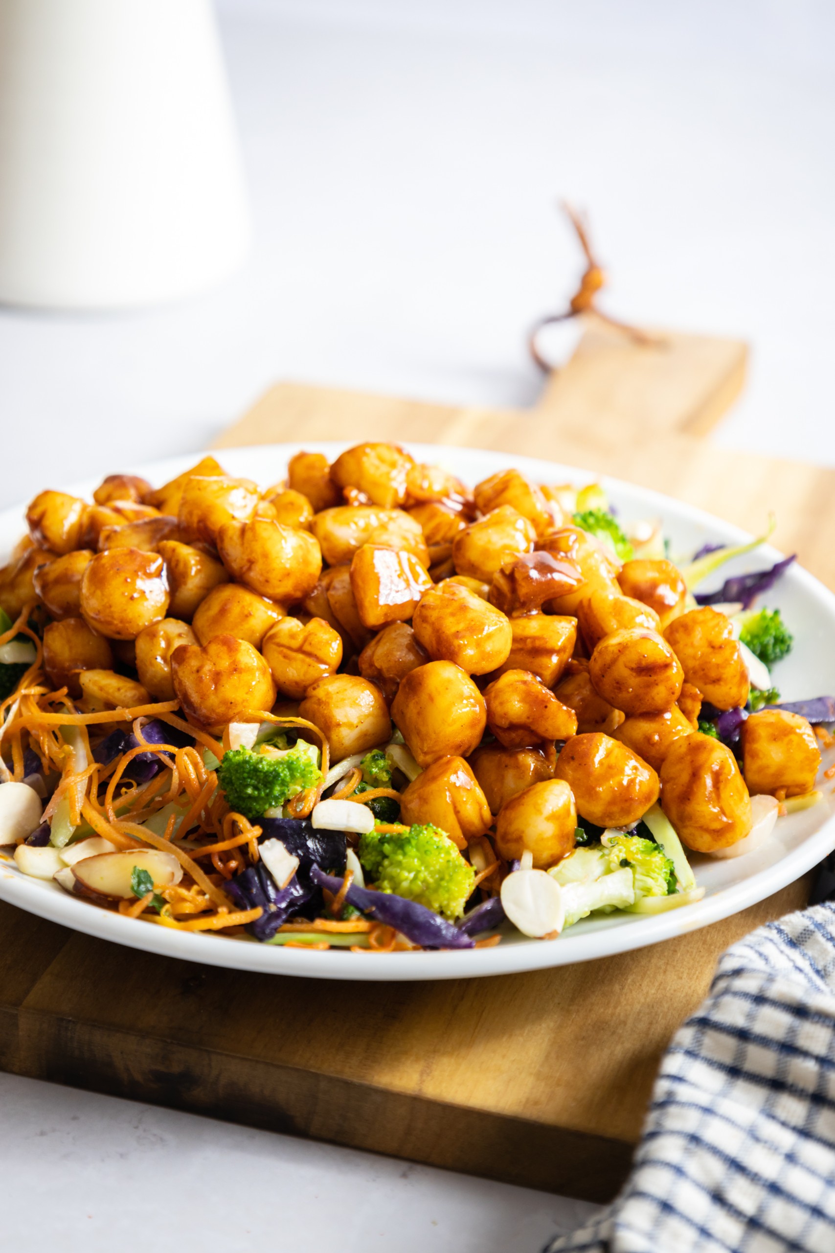 Bay scallops on bed of greens.