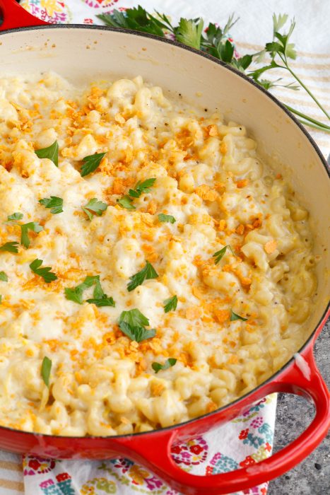 Large pan with zuchinni mac and cheese garnish with parsley.