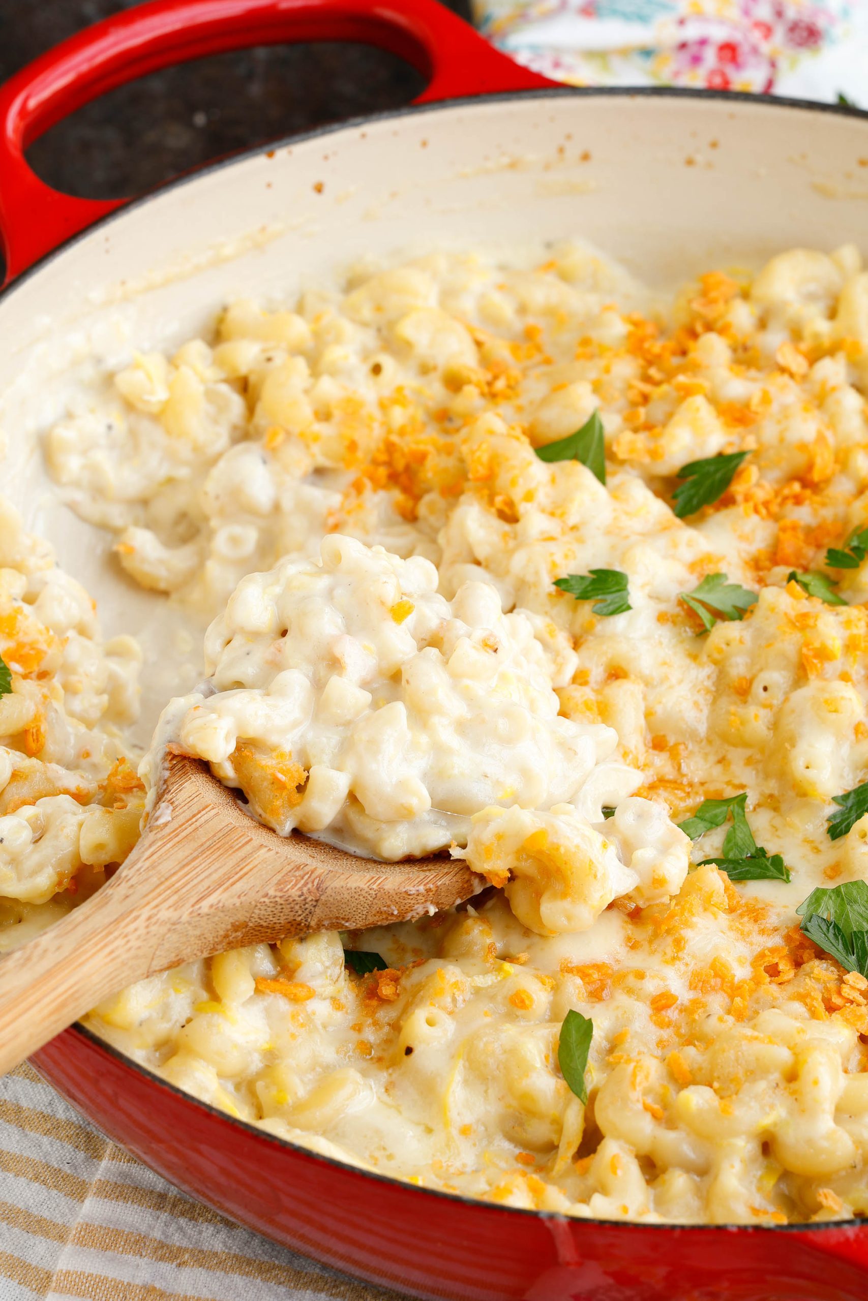 Summer Squash and Zucchini Mac and Cheese, large pan with pasta and cheese and serving spoon.